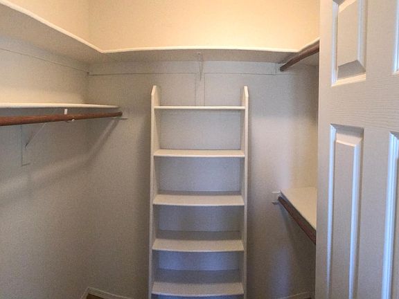 Additional shelf added to walk in master closet. Plenty of room for everything.