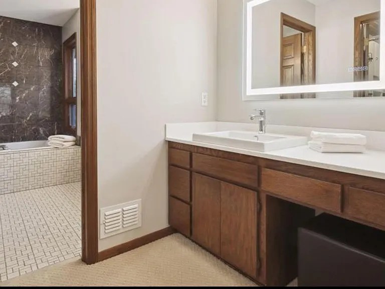Separate sink and dressing area between master bed and bath