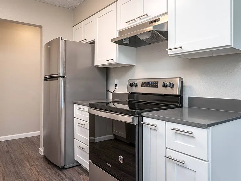 Vantage at Hillsdale | #3 Kitchen with White Cabinetry and Black & Stainless Steel Appliances