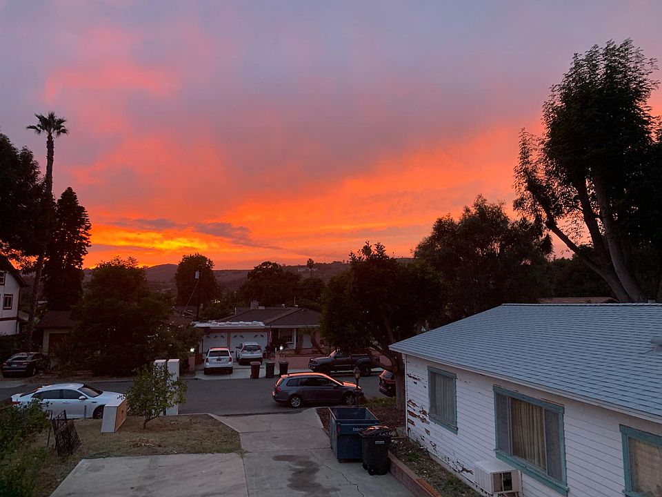View from window of sunset 

(Our house on the right is now painted)