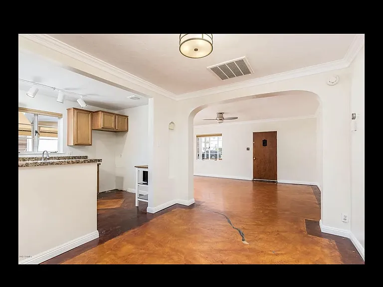 dining room looking toward front door. Fridge and freezer included in kitchen (not pictured)