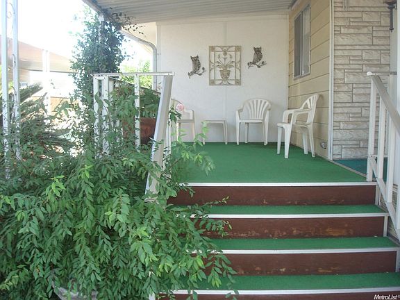 main entrance to the home. in the background is the enclosed porch which has it own entrance from the north side.