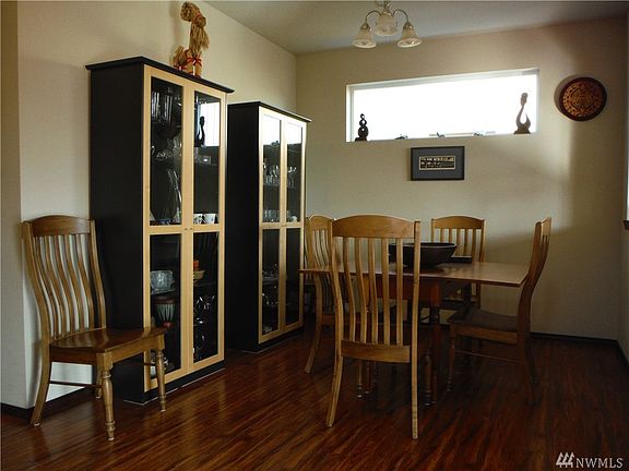 Formal dining room is centrally located, with beautiful laminate wood floors.