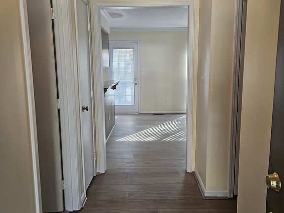 Entryway to Livingroom/kitchen and dining area. Bedrooms on both sides of entryway.