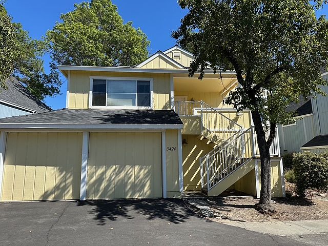Front of home with double car garage.