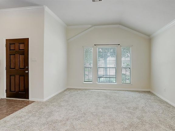 Enter into the spacious living room offering loads of natural light.