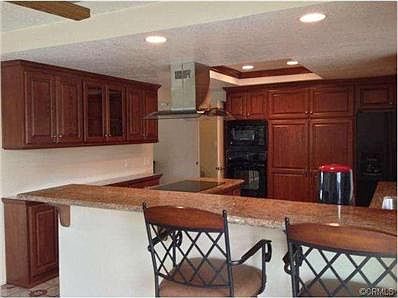 The kitchen has been remodeled with beautiful granite counters a