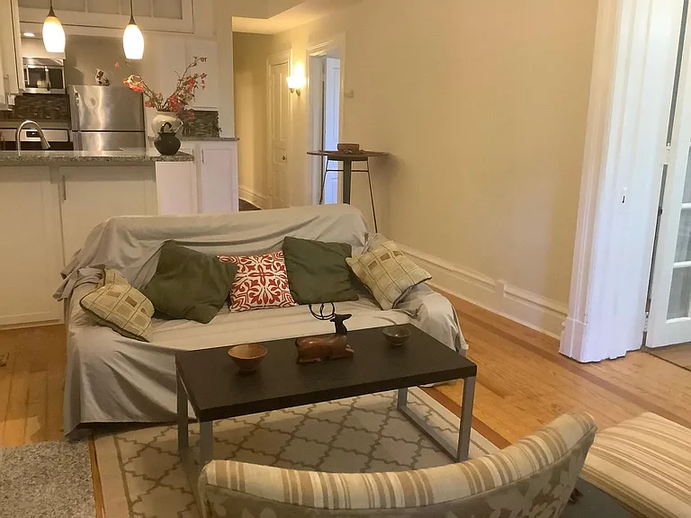 Living room showing entry to both bedrooms.