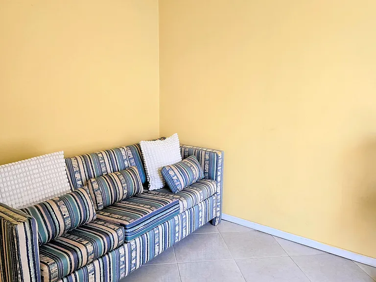Bedroom with sofa bed and office space