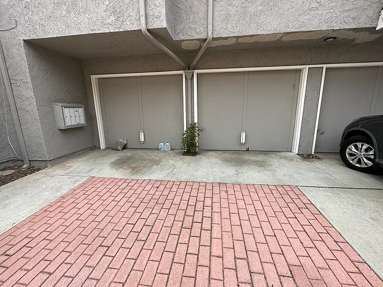 One car garage. The one in the center is for this unit.