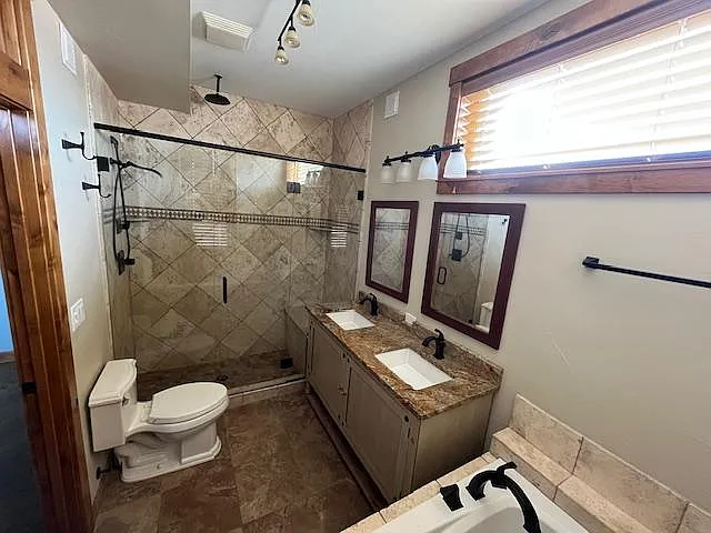 Master bathroom with double vanity and storage