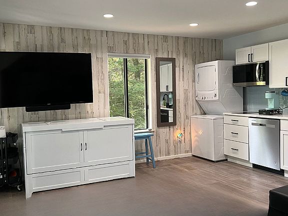 White truck opens to a full-size bed