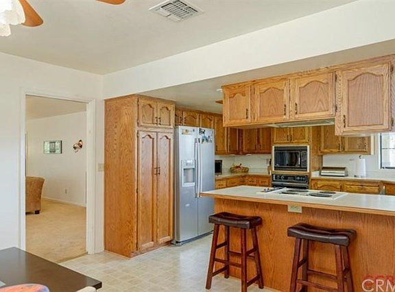The spacious kitchen has seating at the counter or in the breakfast nook and it also flows well into the dining and living room.