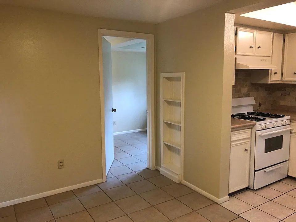 The is the kitchen and living area with a look toward the bedroom.
