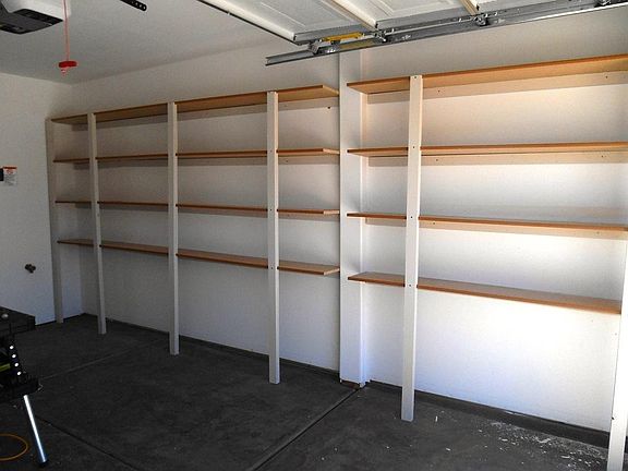 Garage showing built in shelving