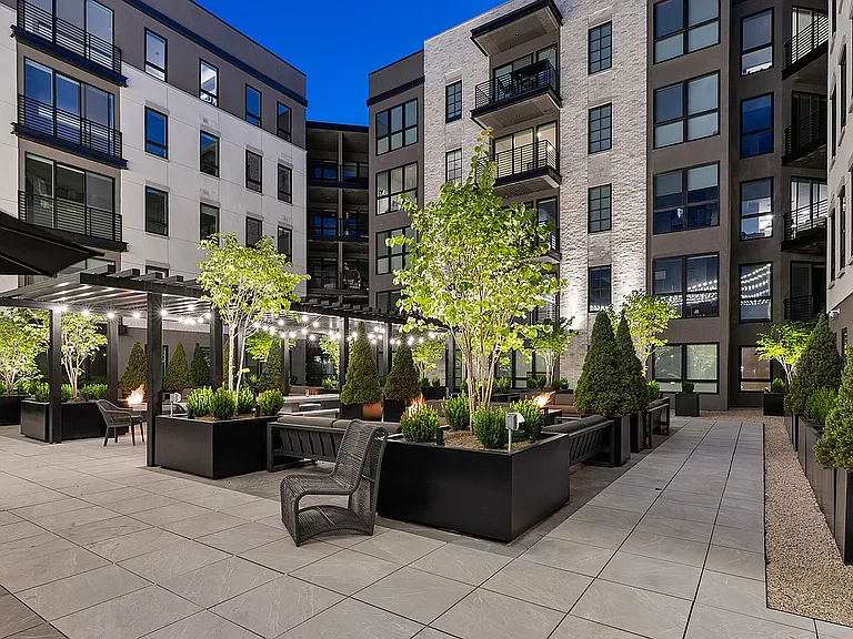 Alternate side view of rooftop pool deck with spa