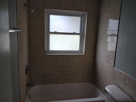 New tile in bathroom with tub.