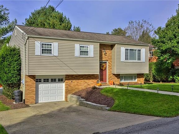 Exterior Front. Extra parking pad for convenience