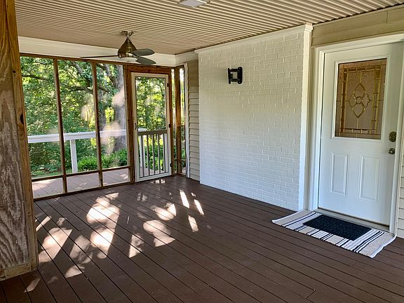 Screened patio with flat screen tv mount and back balcony.