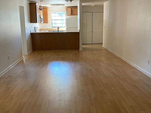 View of Living Room from patio. Laundry area on right.