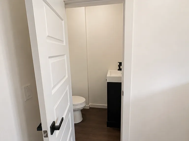 Half bathroom conveniently located on first floor near kitchen and laundry room.