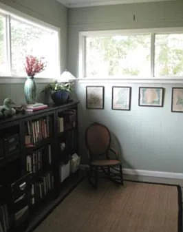 Home office directly off the living room. 
Large windows with lots of natural light.