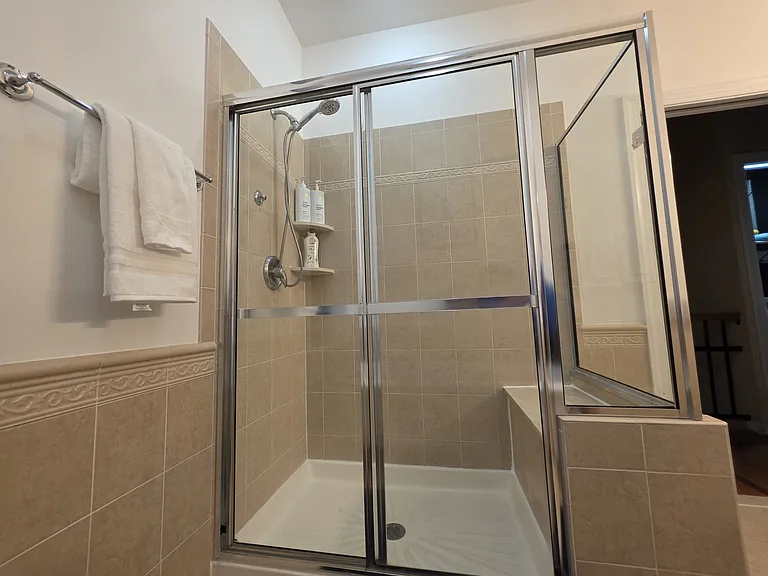 large stand up shower with bench