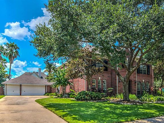 Home features and oversized three car garage.