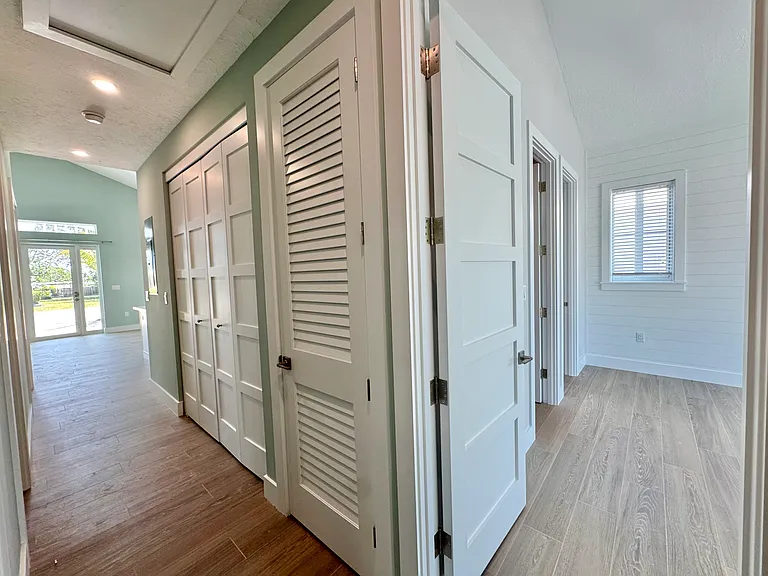 Hallway Looking Toward Front and into Master Bedroom