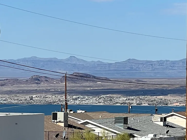 Lake and Mountain view from the Arizona room and rear of property.