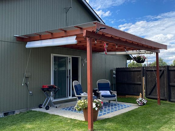 large covered patio in private backyard.
