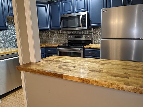 Butcherblock Breakfast Bar opens to the expansive, combination dining and living rooms: form & function