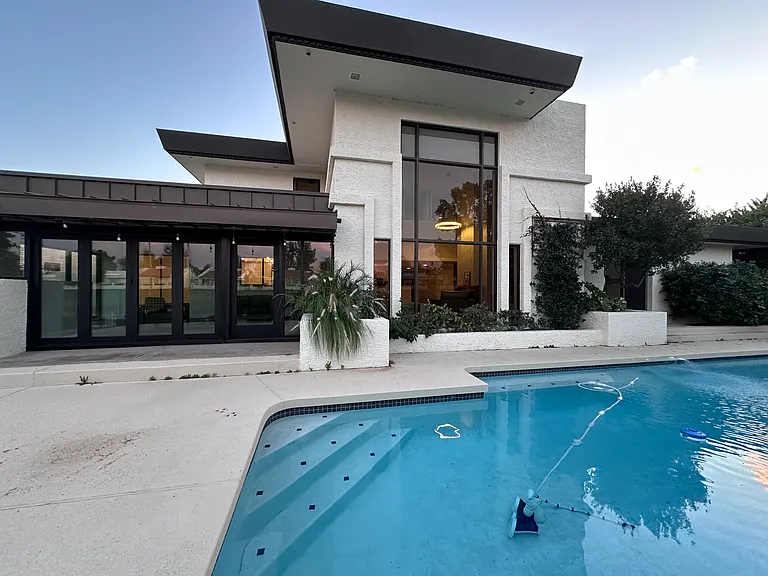 Backyard of the house with swimming pool.