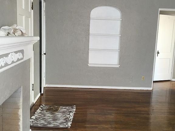 living room with refinished wood floors.
