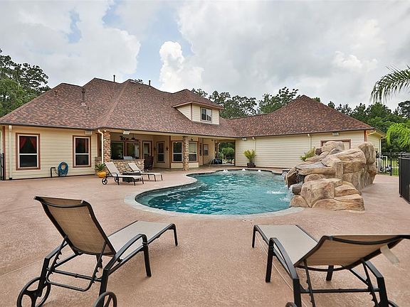 Plenty of decking for any type of party!Pool and Spa built in 2017! Rock slide and waterfall!