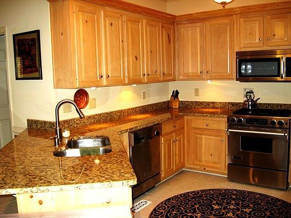 New SS appliances, granite, & custom cabinets make this kitchen shine.