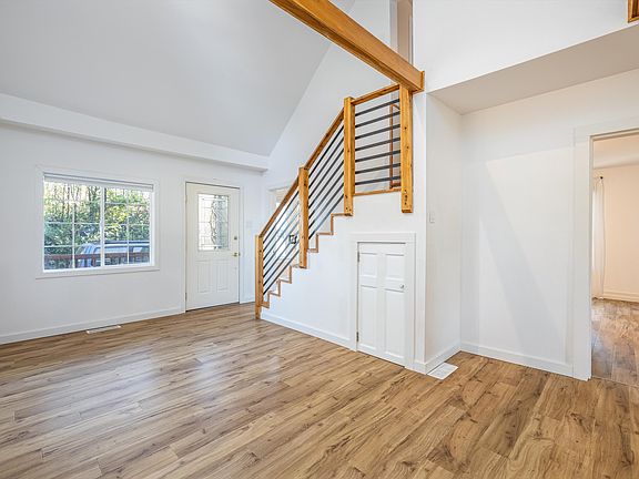 Front entry - living, dining, and primary bedroom on main.