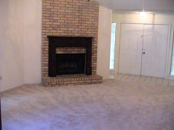 Large Living Room has Vaulted Ceilings and Fireplace !