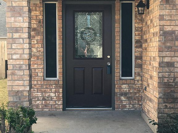 Beautiful front door greets you as you approach the home. 