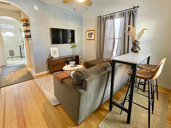 Comfortable and cozy living area with dedicated high-top dining space