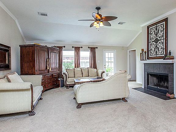 Large open concept living area with fire place, perfect for entertaining.