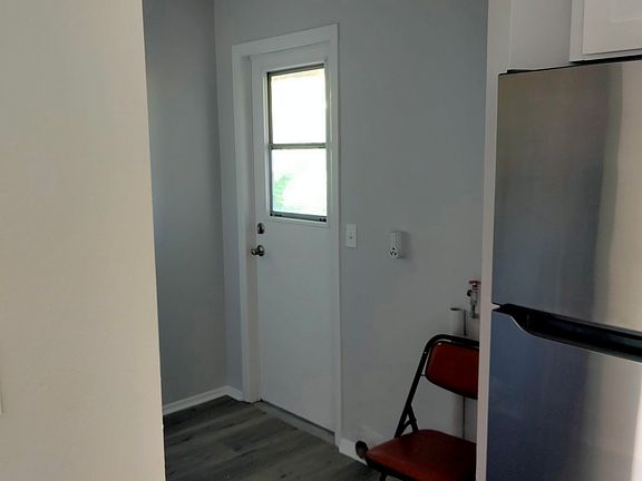 Laundry room and door to backyard
