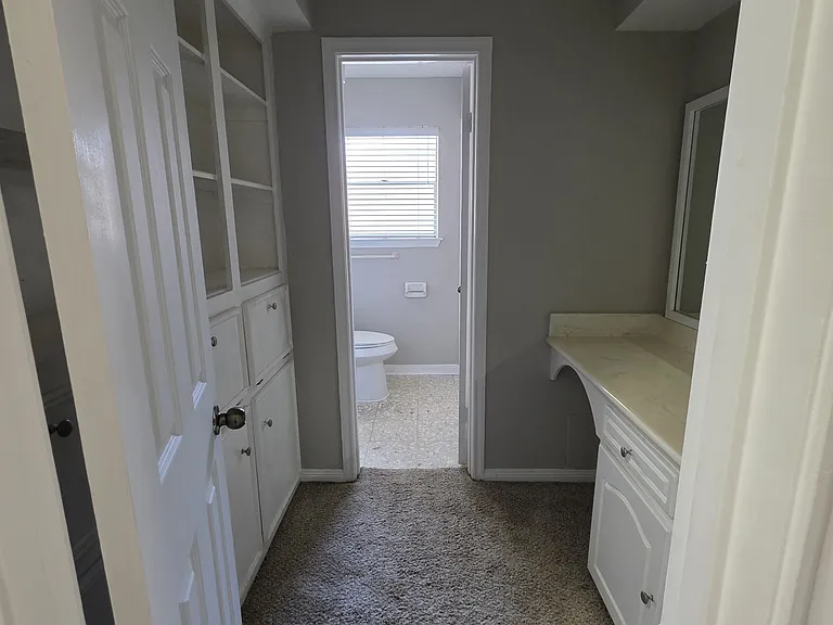 Shared / guest bathroom with tons of storage space.
