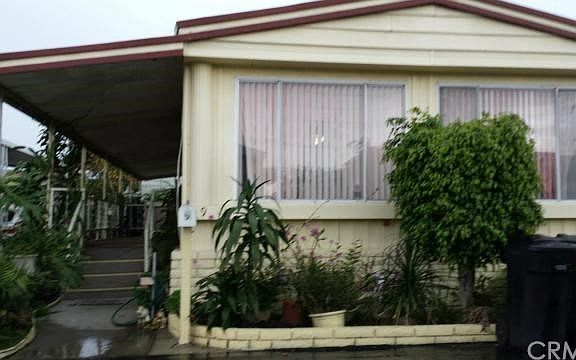 FACING FRONT WINDOWS AND VERANDA
