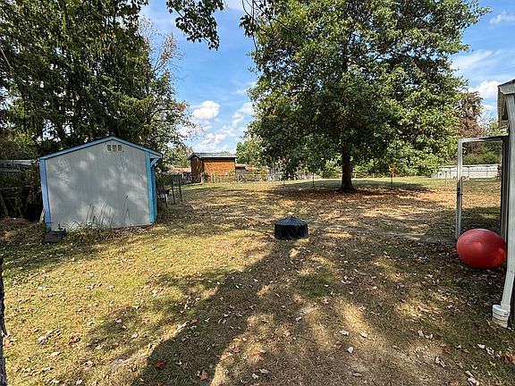 Looking rearward from fence gate; the enclosed porch is to the right