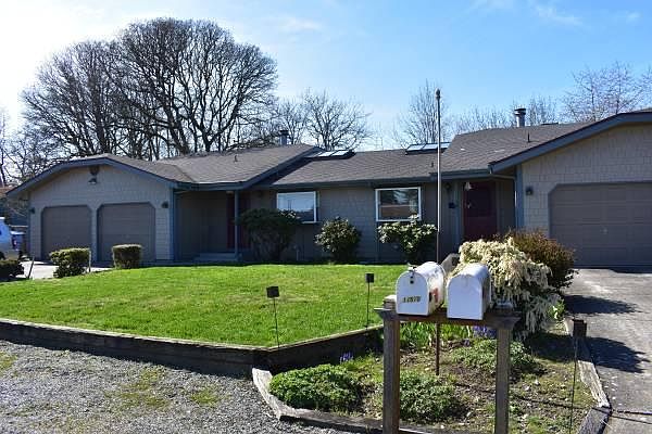 Front yard and 2 car garage