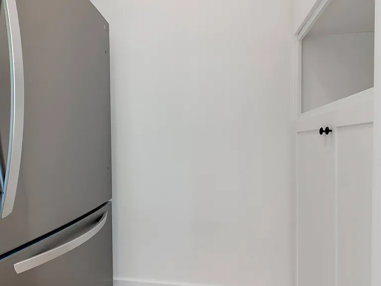 Refrigerator with pantry off the kitchen.