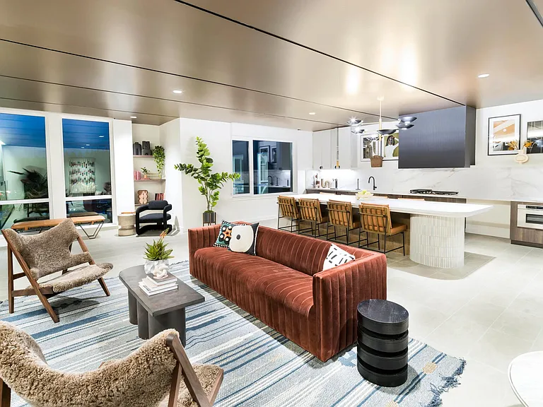 Our expansive clubroom features cozy lounge seating, a welcoming fireplace, and a modern kitchen_perfect for hosting or relaxing.