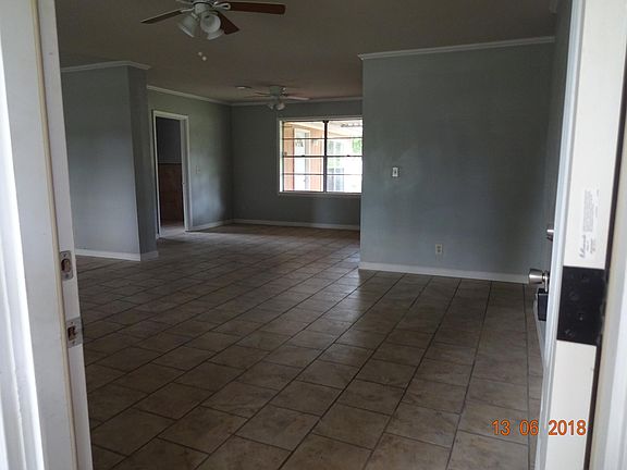 Coming in the front door to the open living room and dining 