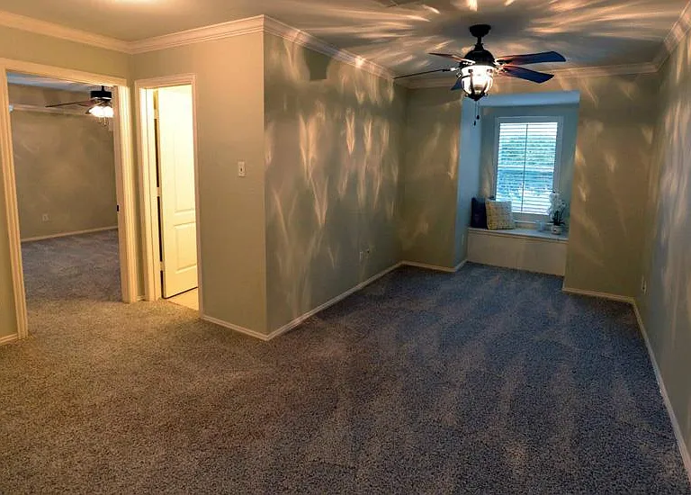 Game room with cozy shelf window seat overlooking pool / patio / backyard